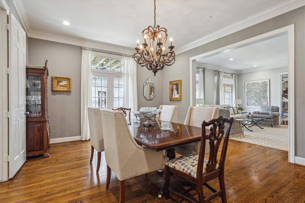 Formal dining room with cased opening to living room and french doors to the back patio.
