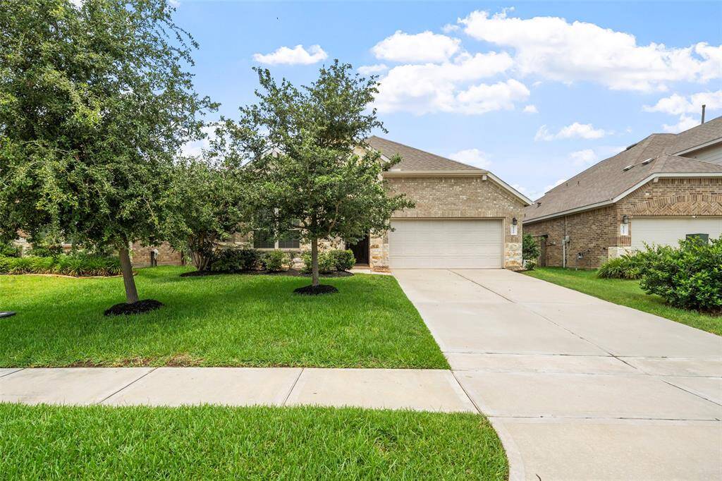 The driveway is long and wide with room for large vehicles.