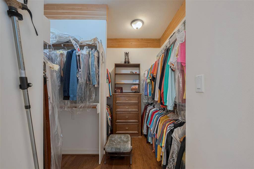 The second spacious walk-in closet is also conveniently located off the primary bathroom.