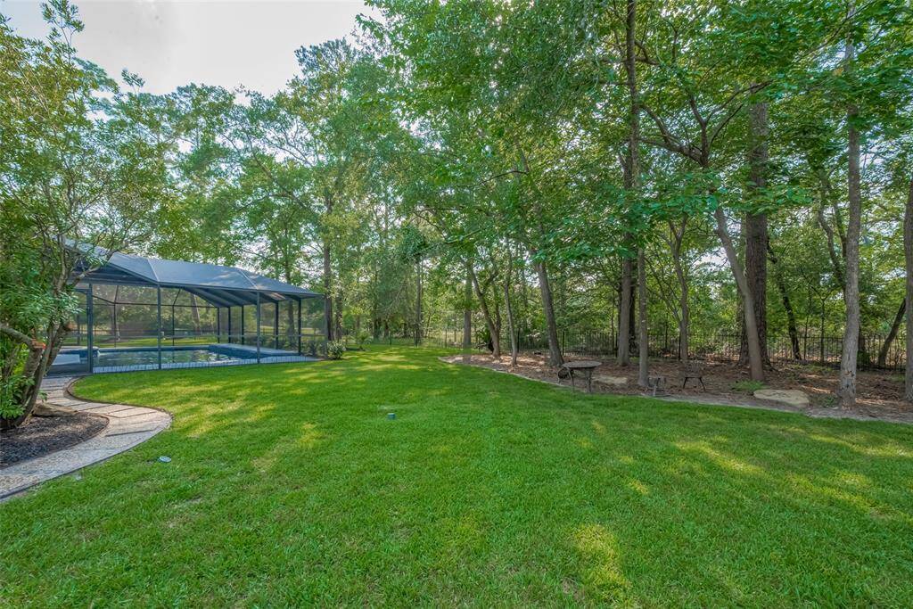 This spacious cul-de-sac lot measures approximately 19,290 sq. ft. (per HCAD) and features French drains, full sprinkler coverage, updated landscaping, abundant mature trees, and scenic views of the golf course.
