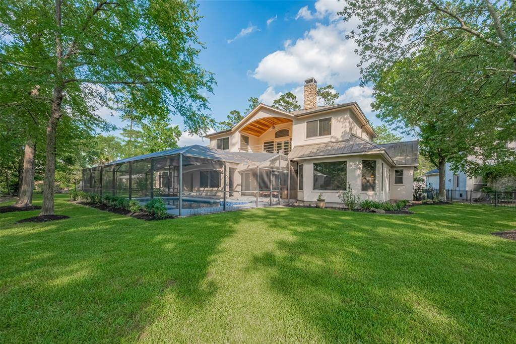 The home features a unique metal roof with commercial-grade gutters on the upper section, 2x6 exterior framing, extra insulation, double-pane windows, and a radiant barrier attic—all designed to keep utility bills lower than average for a home of this size.