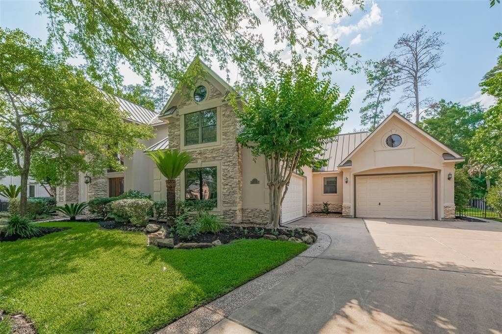The architect preferred to keep large garage doors out of the front view, so this home—like others they design—has the garages positioned to the side and facing away from the street. The front-facing windows (generally on the east side) are slightly tinted for added privacy and comfort.
