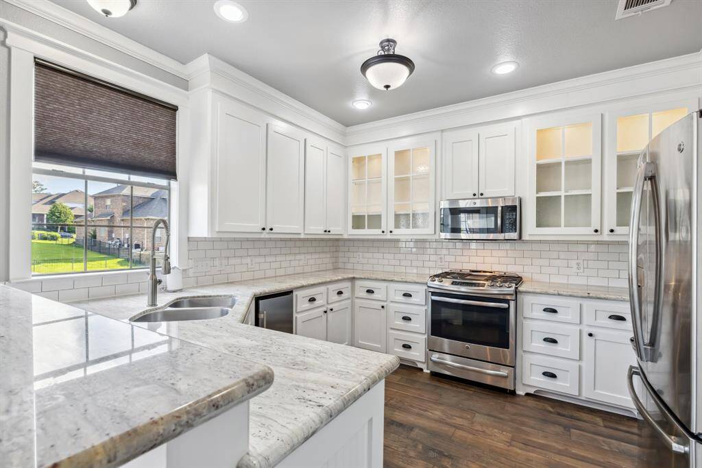 Upgraded counter tops with lots of serving space. Notice the updated appliances as well