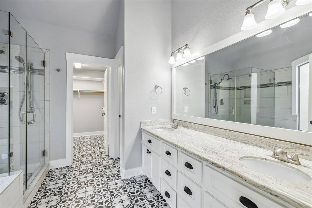 Upgraded master bathroom with walk in closet