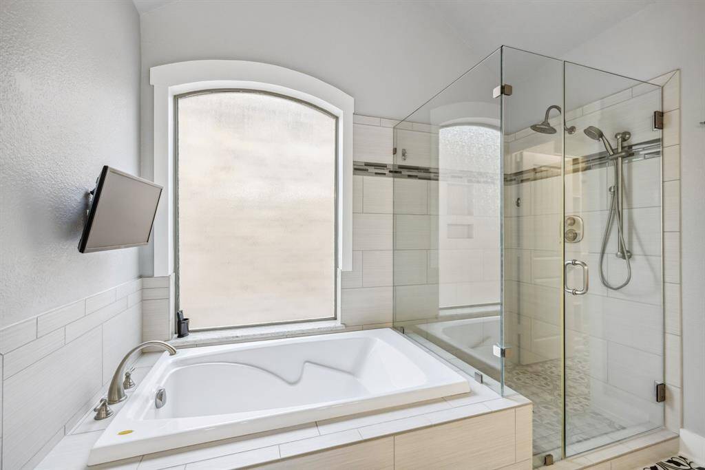 Separate tub and shower in the master bathroom