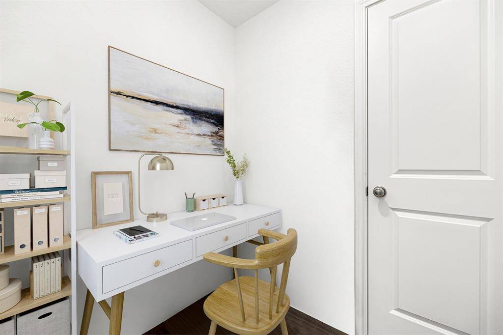 This cozy bonus area, tucked just off the kitchen, offers the perfect spot for focused work or homework sessions.