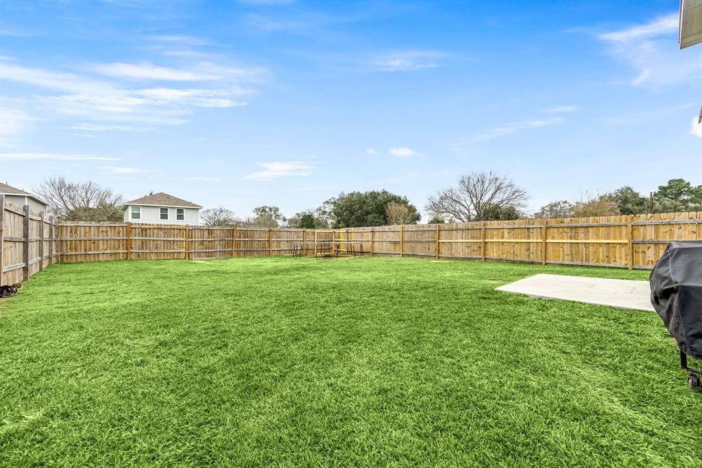 Come and see this spacious backyard, with concrete pad and plenty of room for the kids to play and adults to relax!