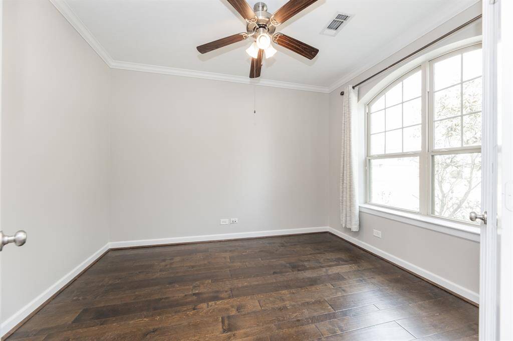 A beautiful home office with French doors for privacy.
