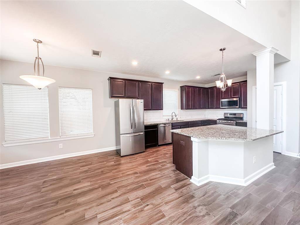 Living room opens to the kitchen and the breakfast nook.