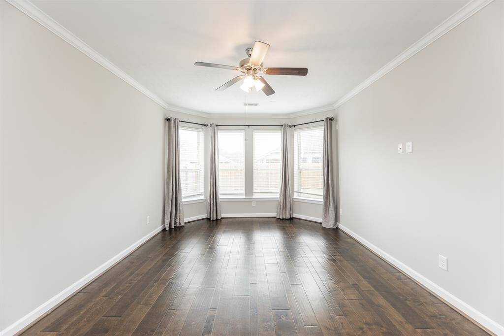 Ample natural light from the bay windows in the primary suite.