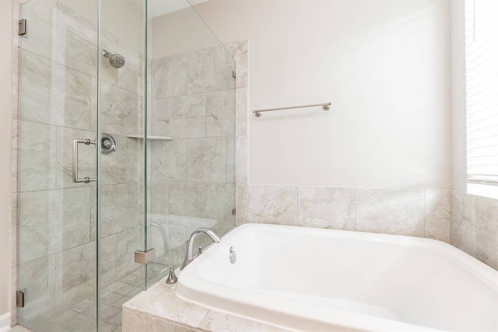 Farmless shower door and soaking tub.