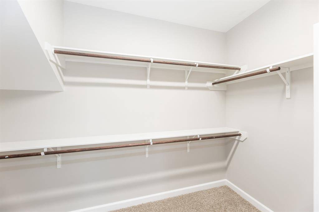 Primary suite walk-in closet.
