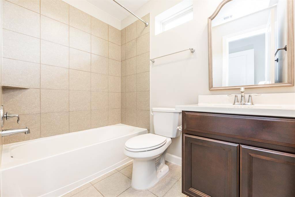 Upstairs secondary bedroom with private bathroom.
