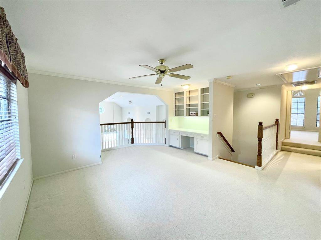 A full view of what this game room offers. Easy access to stairs and open to the other bedrooms, this room is the focal point of the second floor.