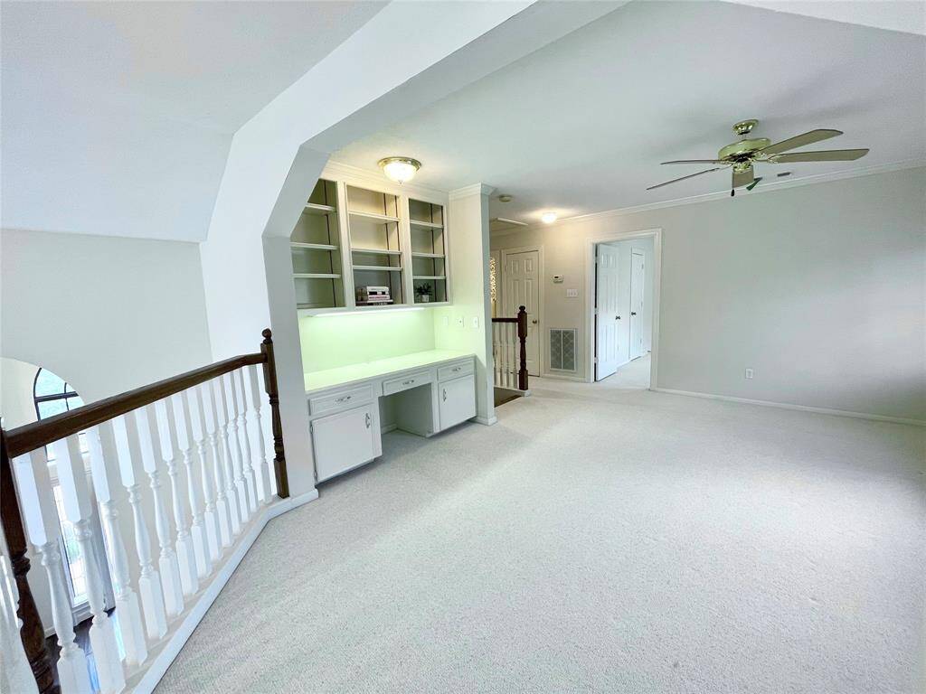 Gameroom with built-in study nook, and shelves. This room is open and overlooks the first floor.