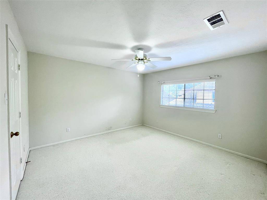 Spacious bedroom on the second floor next to the game room, berber carpet, large walk-in closet with built-in shelves for shoes or purses and built-in drawers.