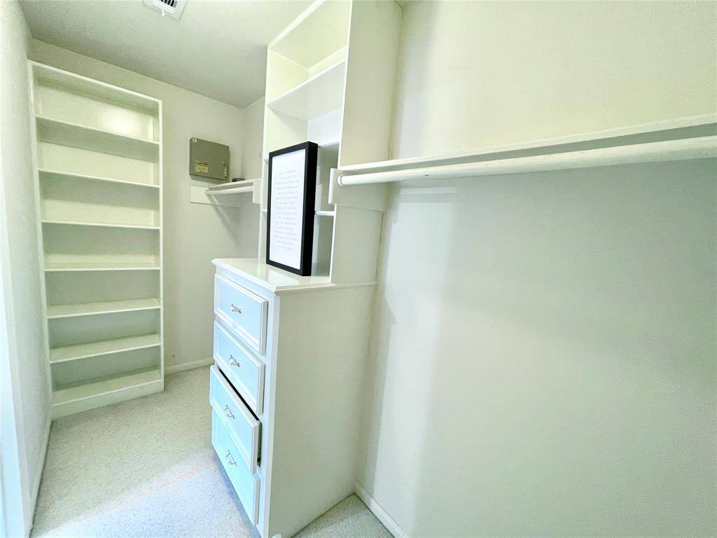 All bedrooms have large walk-in closets with built-in shelves and drawers.