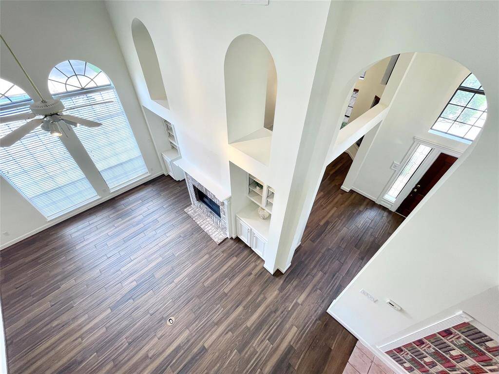 So much charm this home offers with the massive ceilings and open arched niches.