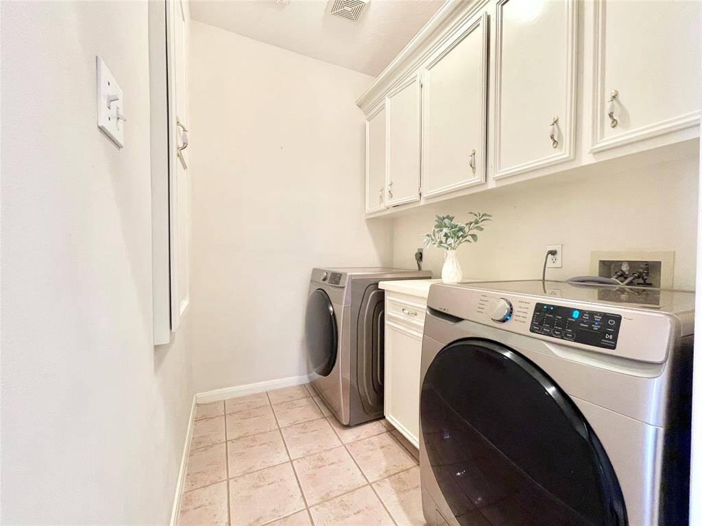 Nice sized first floor utility room with cabinets for storage. Washer/Dryer included.