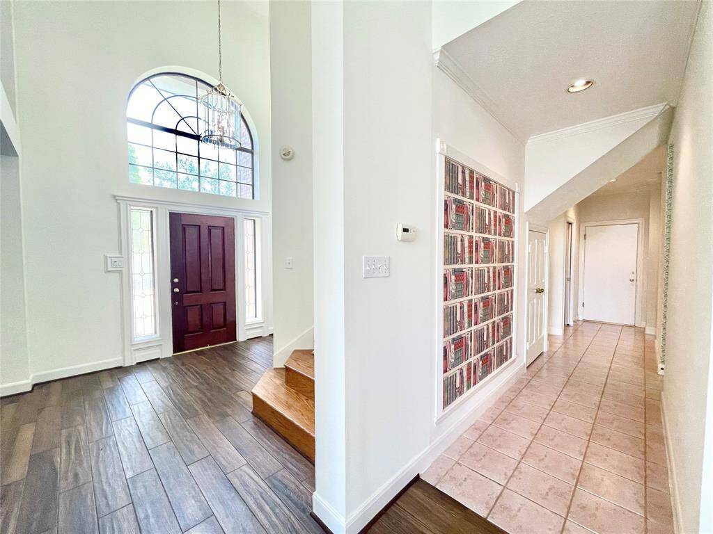 Entry and hallway to master, garage, and utility room.