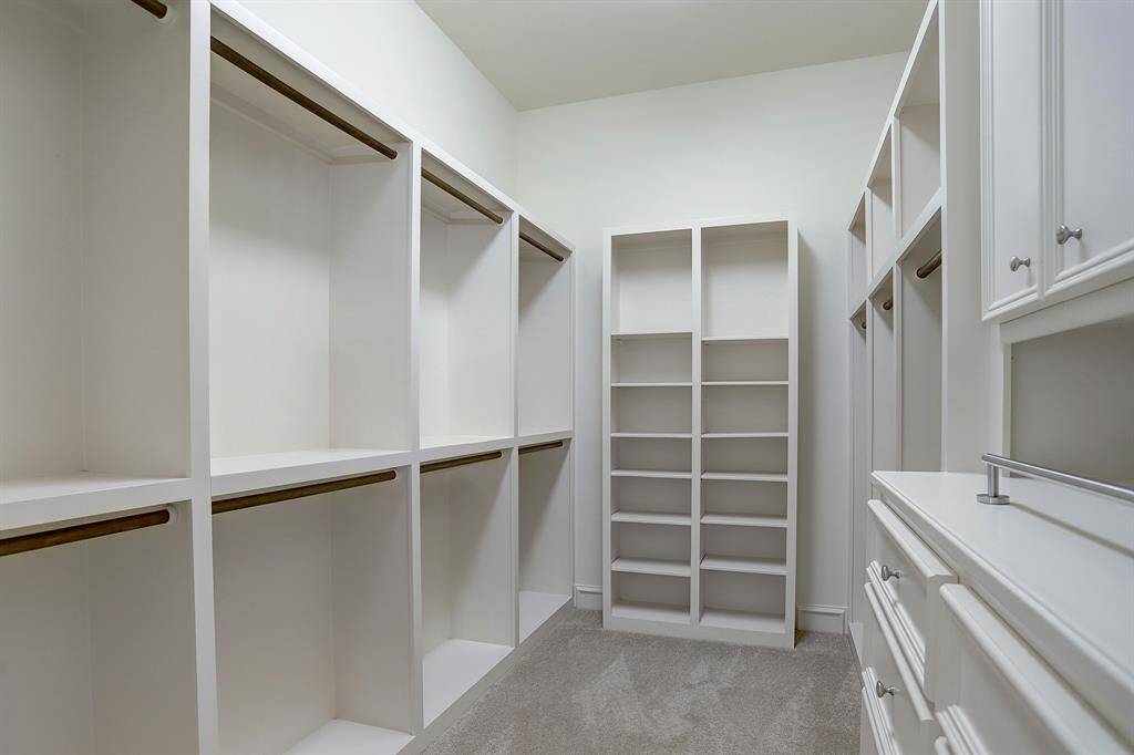 One of two walk-in closets in primary bath.