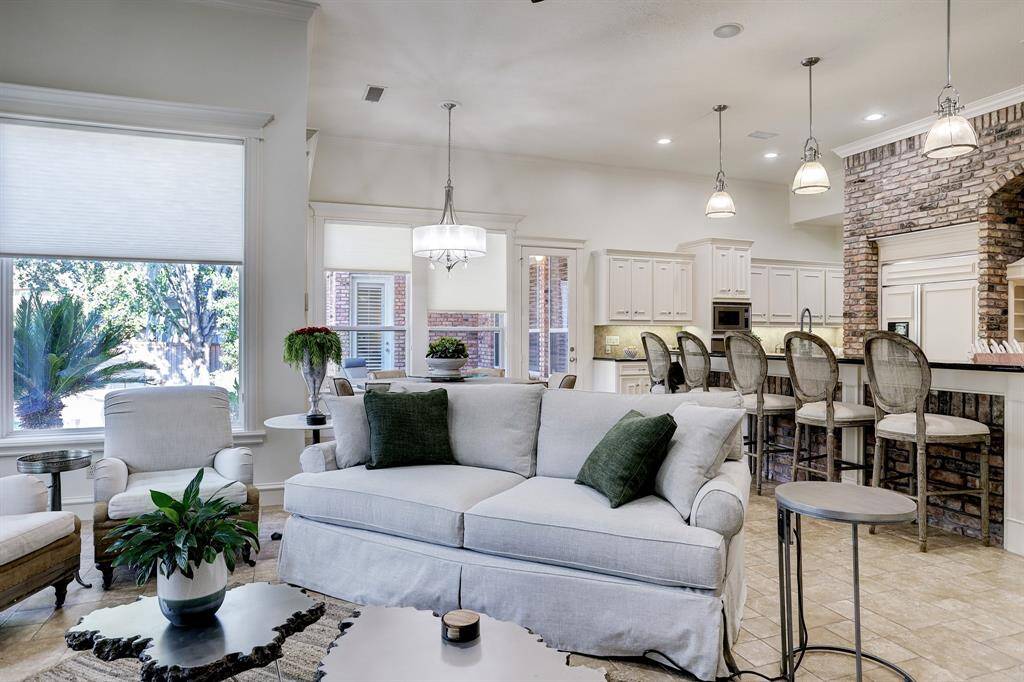 Kitchen overlooks family room.