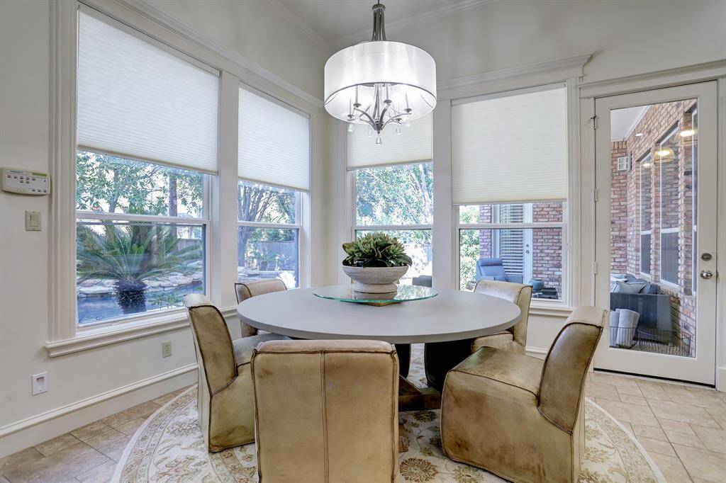 Breakfast open to family room and overlooks the pool.