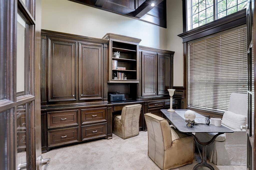 Office features high ceilings and plenty of natural light.