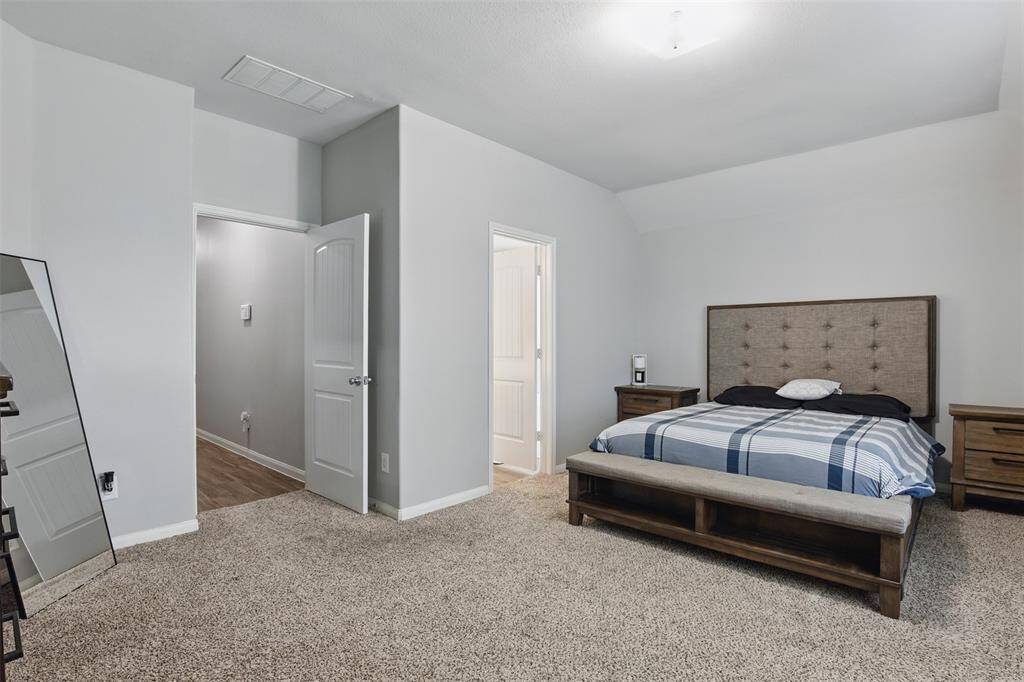 Step into the sanctuary of theprimary bedroom.