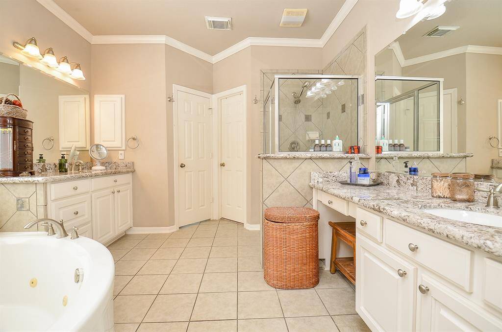 Primary Bathroom offers double vanity areas with granite countertops!