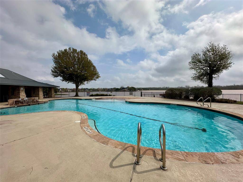 Beautiful Community Pool with a waterfall and great views of the Lake!