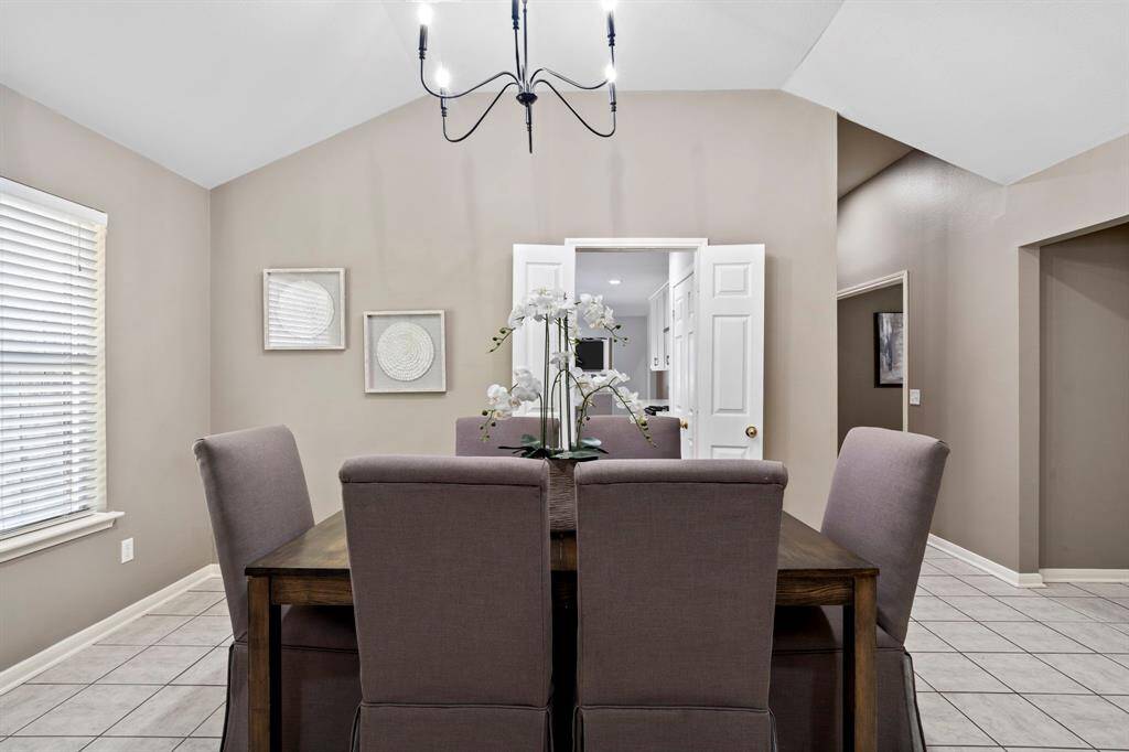 A direct view into the kitchen from the dining room enhances functionality and makes entertaining both easy and enjoyable.