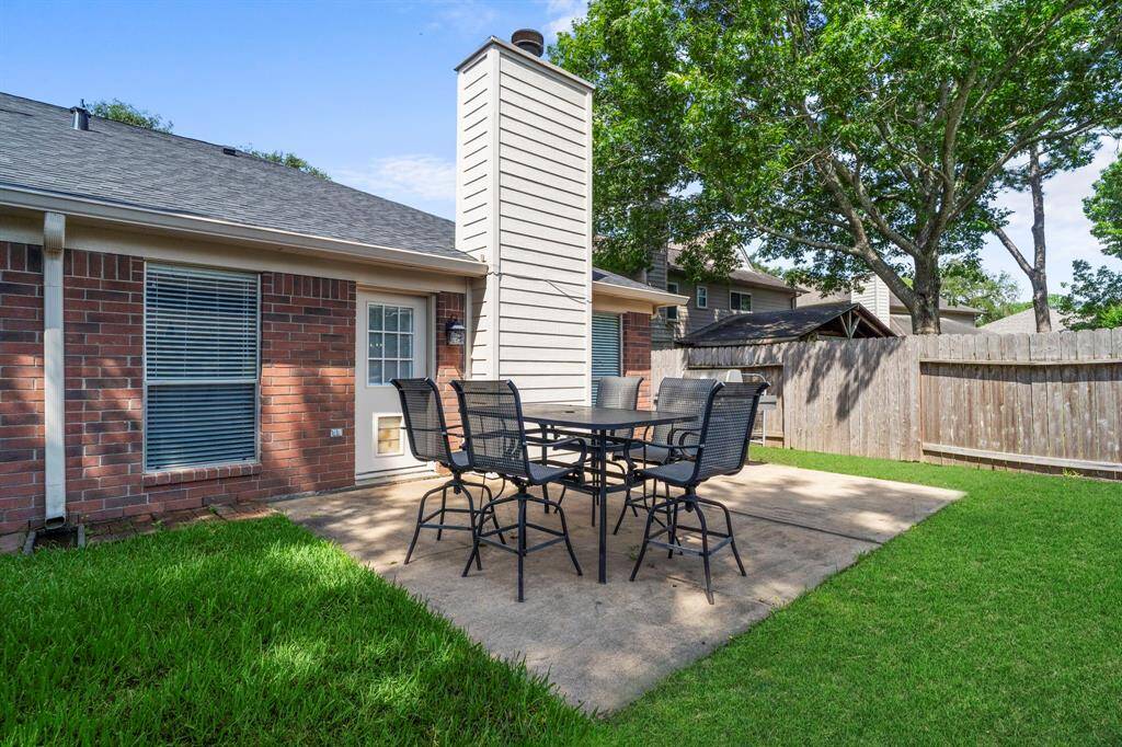 The large patio area just off the back door offers easy access for grilling, dining, or enjoying fresh air anytime.
