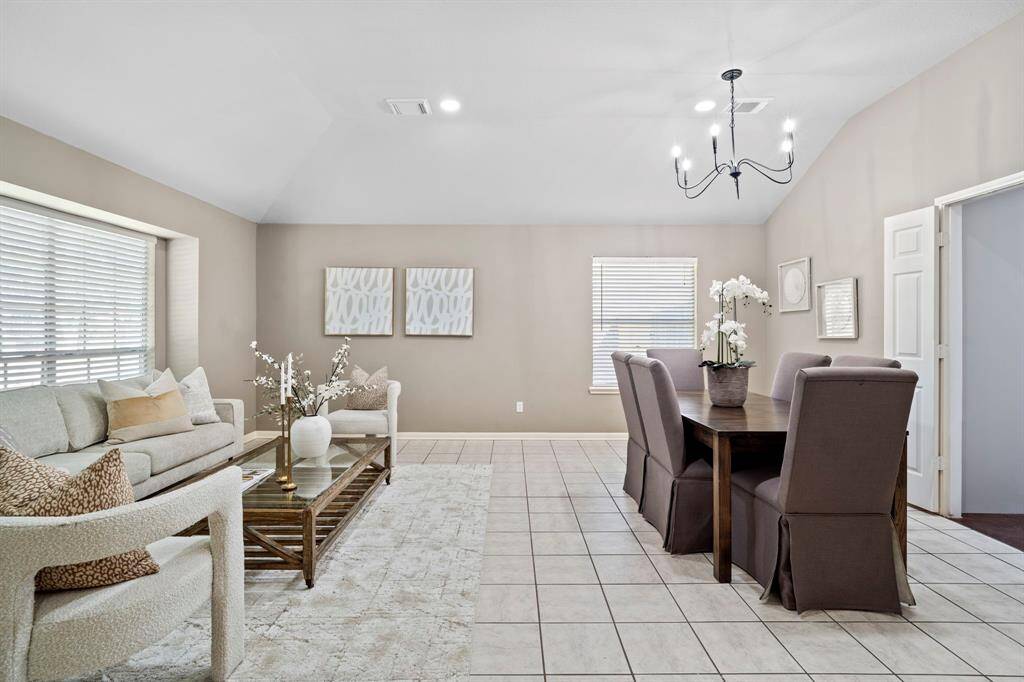 This open-concept layout connects the formal living and dining areas, offering ample space for entertaining and everyday enjoyment.