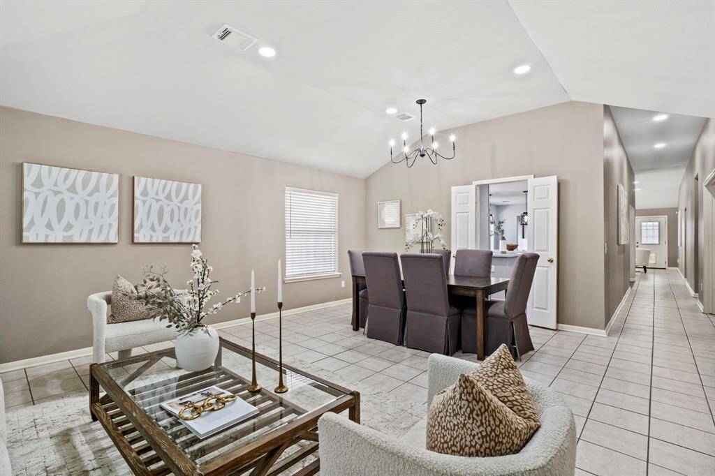 From this angle, you can appreciate how the formal living and dining areas flow effortlessly into the central hallway and beyond.