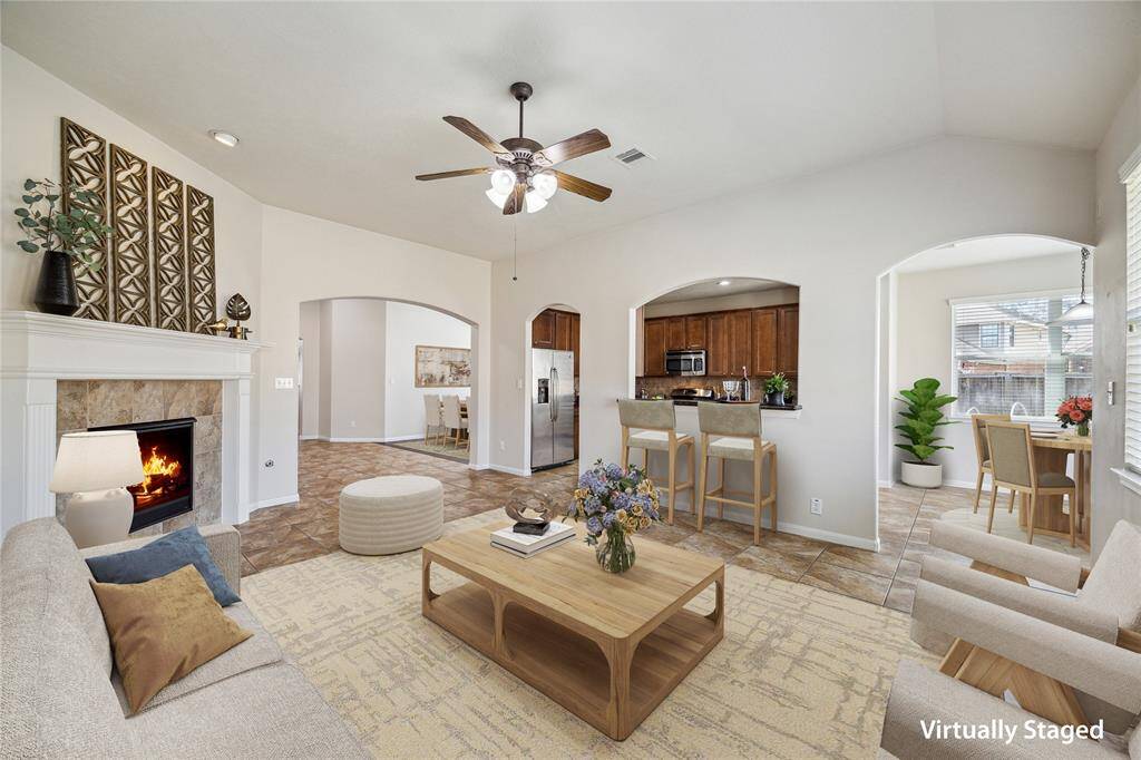 Alternate view of living room looking into the kitchen, breakfast nook & dining room.