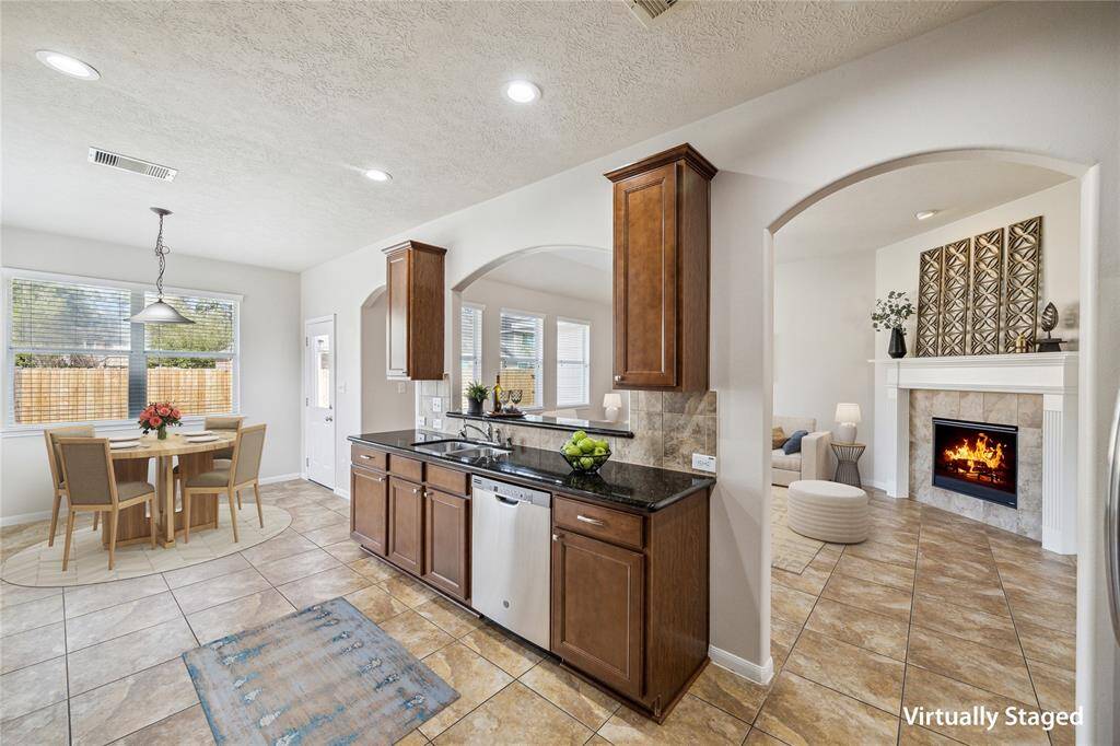 Alternate view of the kitchen into the family room.