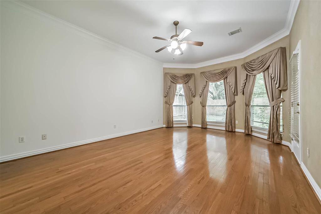 The master bedroom features a lovely bay window.
