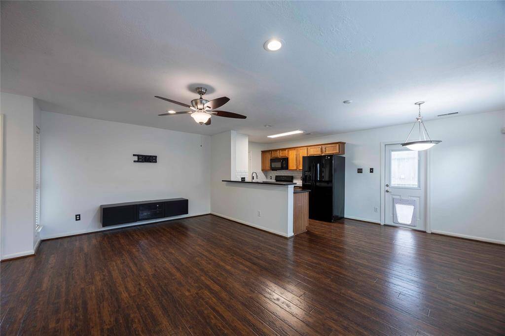 View of living/dining/kitchen