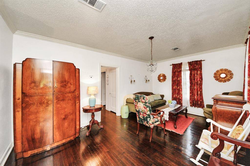 The den connects seamlessly to the bedroom hallway. The home's layout is functional yet filled with unique details adding to its appeal.