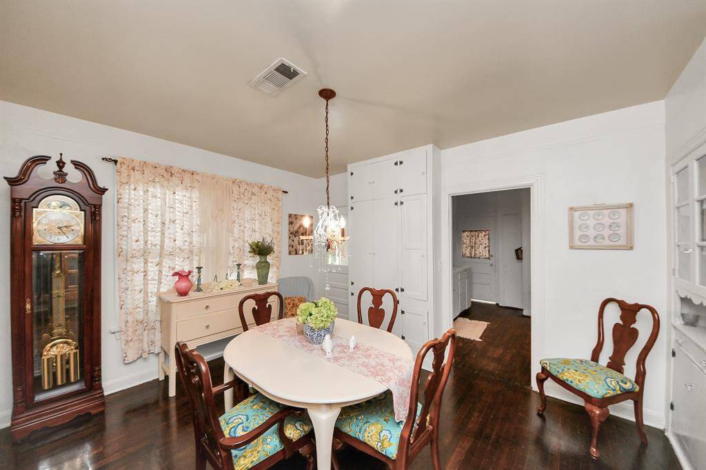 A closer look reveals a spacious dining room filled with natural light and timeless details—perfect for family meals and celebrations.