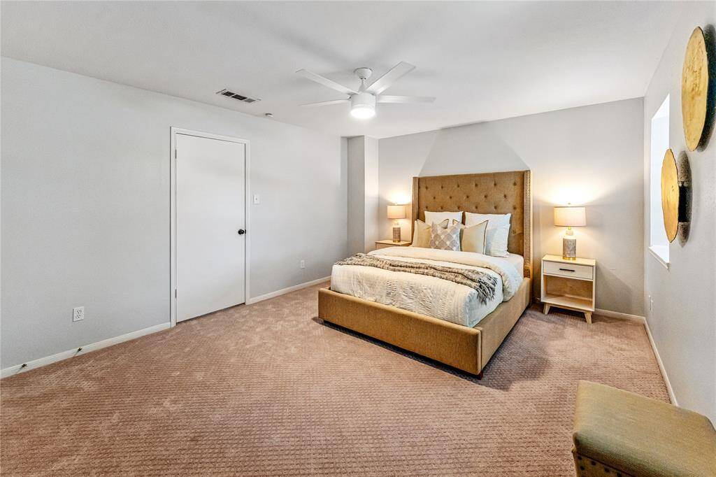 The spacious main bedroom, facing the front of the home has two windows bringing natural light inside. The brand new plush carpet and neutral walls create a cozy and inviting atmosphere.