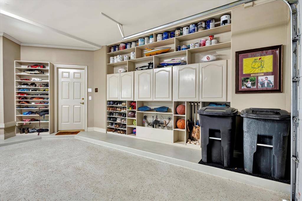 This inviting room features large windows with wooden accents, offering abundant natural light and scenic views. It includes a cozy seating area perfect for card table, elegant wall paneling, and a stylish overhead light fixture. Access to huge covered balcony with safety railing. Fabulous breezes.