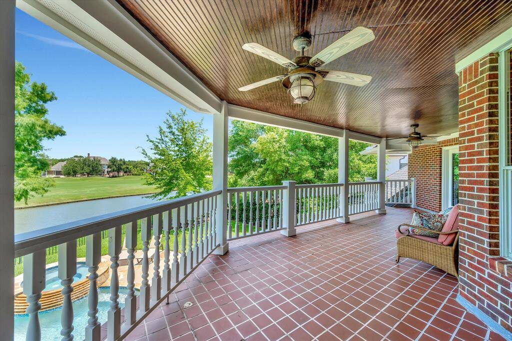 This property features a stunning backyard with a pool and hot tub, offering views of lush greenery and a serene pond. Perfect for relaxation and outdoor entertainment for large gatherings.