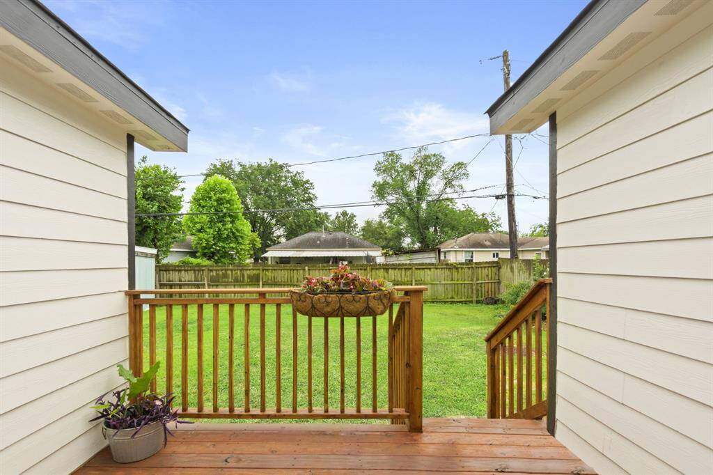 Step out of kitchen to back porch.