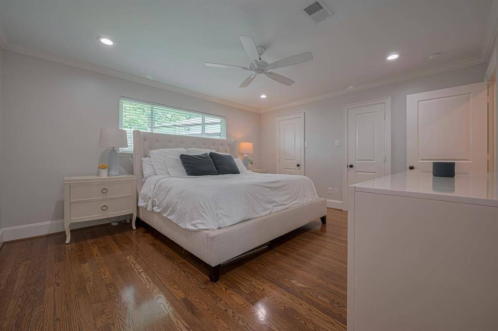 PRIMARY BEDROOM - The primary bedroom is downstairs and has beautiful hardwood floors two closets!