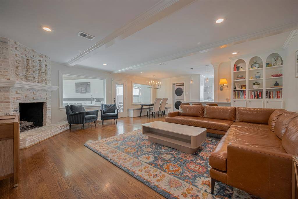 LIVING ROOM - Large bright windows and views of the backyard as well as built-ins for storage.