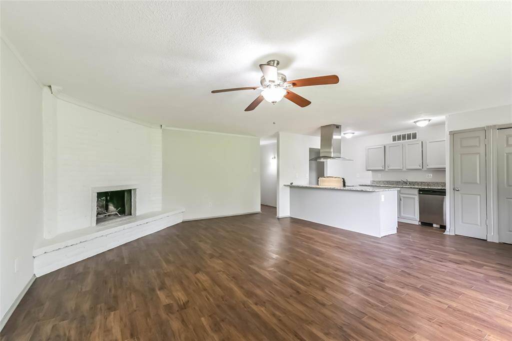 Living room is open concept into kitchen and dining area