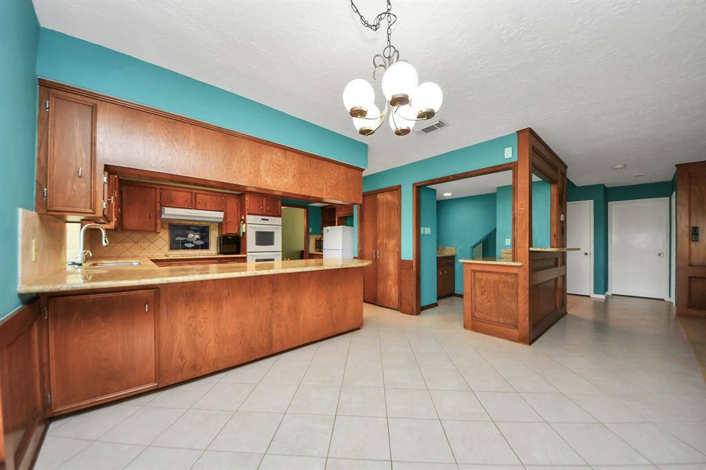 The primary bedroom in this house is amazing! It's huge with enough space for a big seating area.
