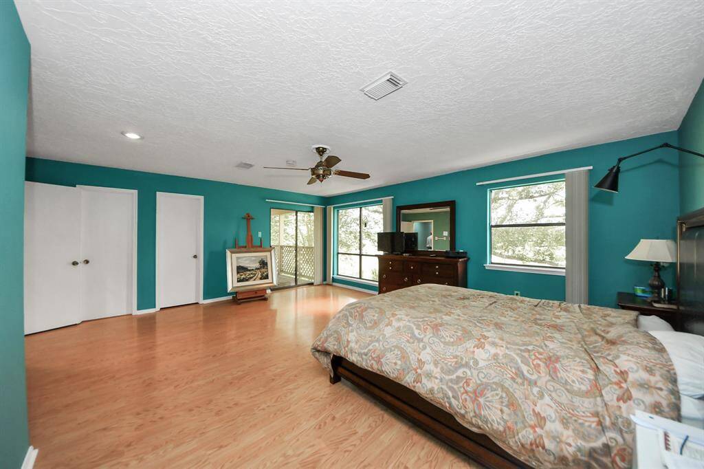The primary bedroom in this house is amazing! It's huge with enough space for a big seating area.
